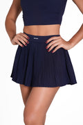 Navy blue activewear Solrise' Skirt worn by a weomen on a white background